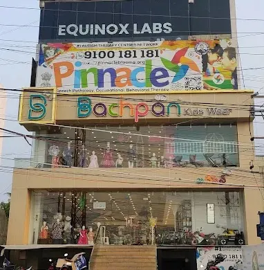 Building and Pinnacle signage at Chanda Nagar.
